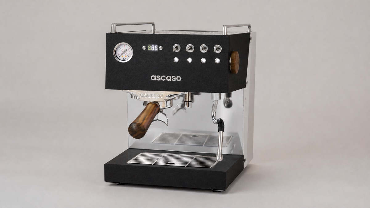 Ascaso Steel Duo PID espresso machine in black with walnut portafilter handle on a plain background